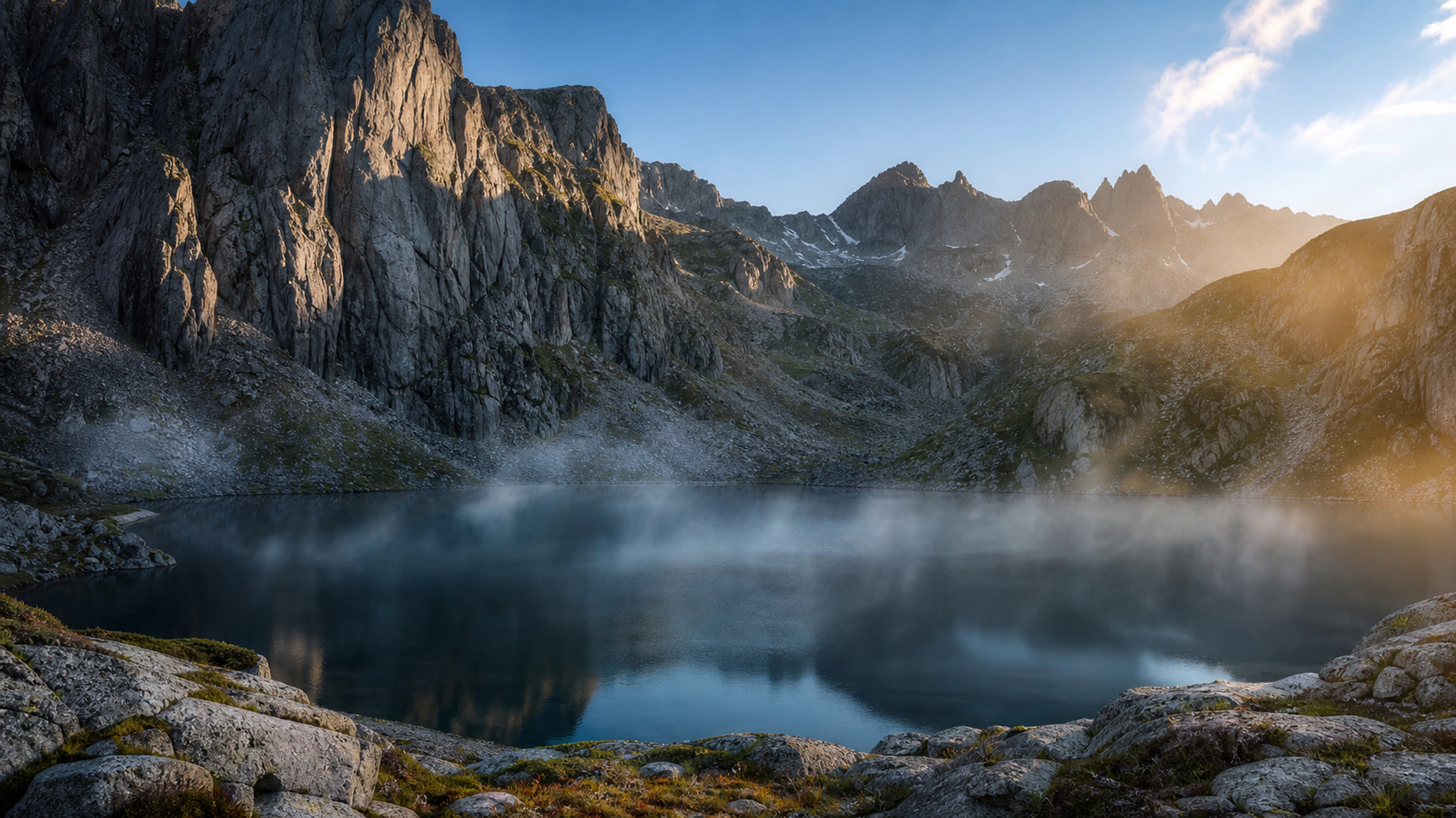 Small circular tarn enclosed by steep granite walls, morning mist lifting from the water, original 4K nature wallpaper