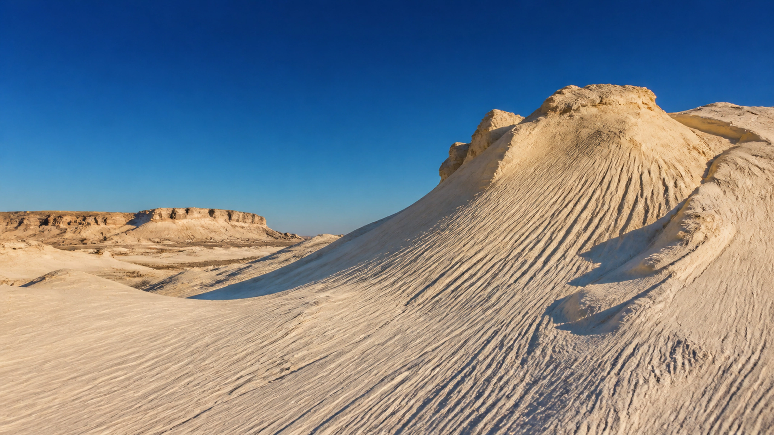 Pale gypsum dunes beneath cobalt sky with elegant wind-carved ridges, original 4K desert wallpaper