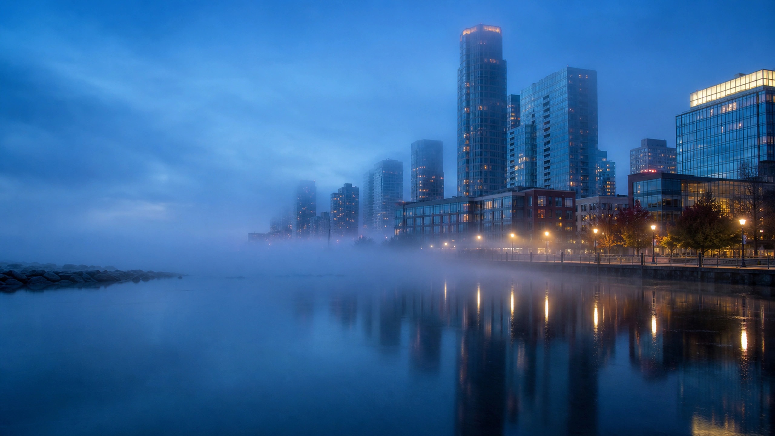 Low sea fog softening harbor towers and lamps, minimal cool-toned cityscape, original 4K cities wallpaper