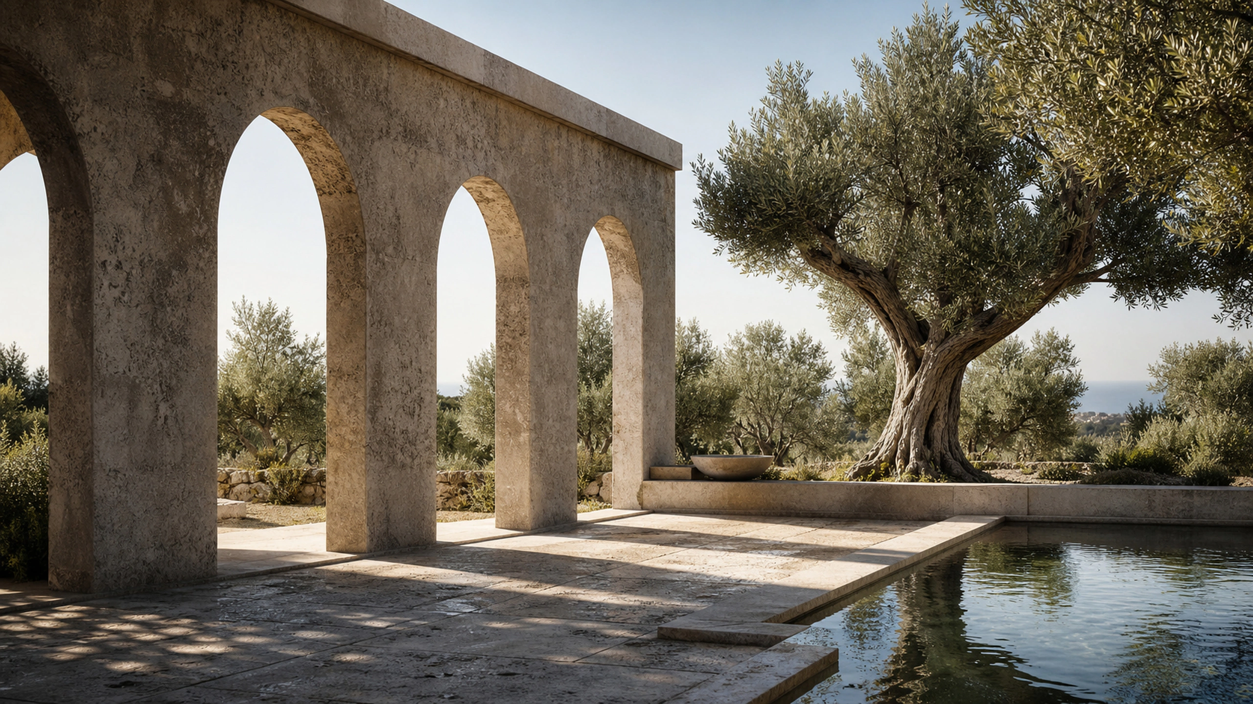 Weathered local-stone arcade opening to an olive garden under strong Mediterranean daylight, original 4K architecture wallpaper