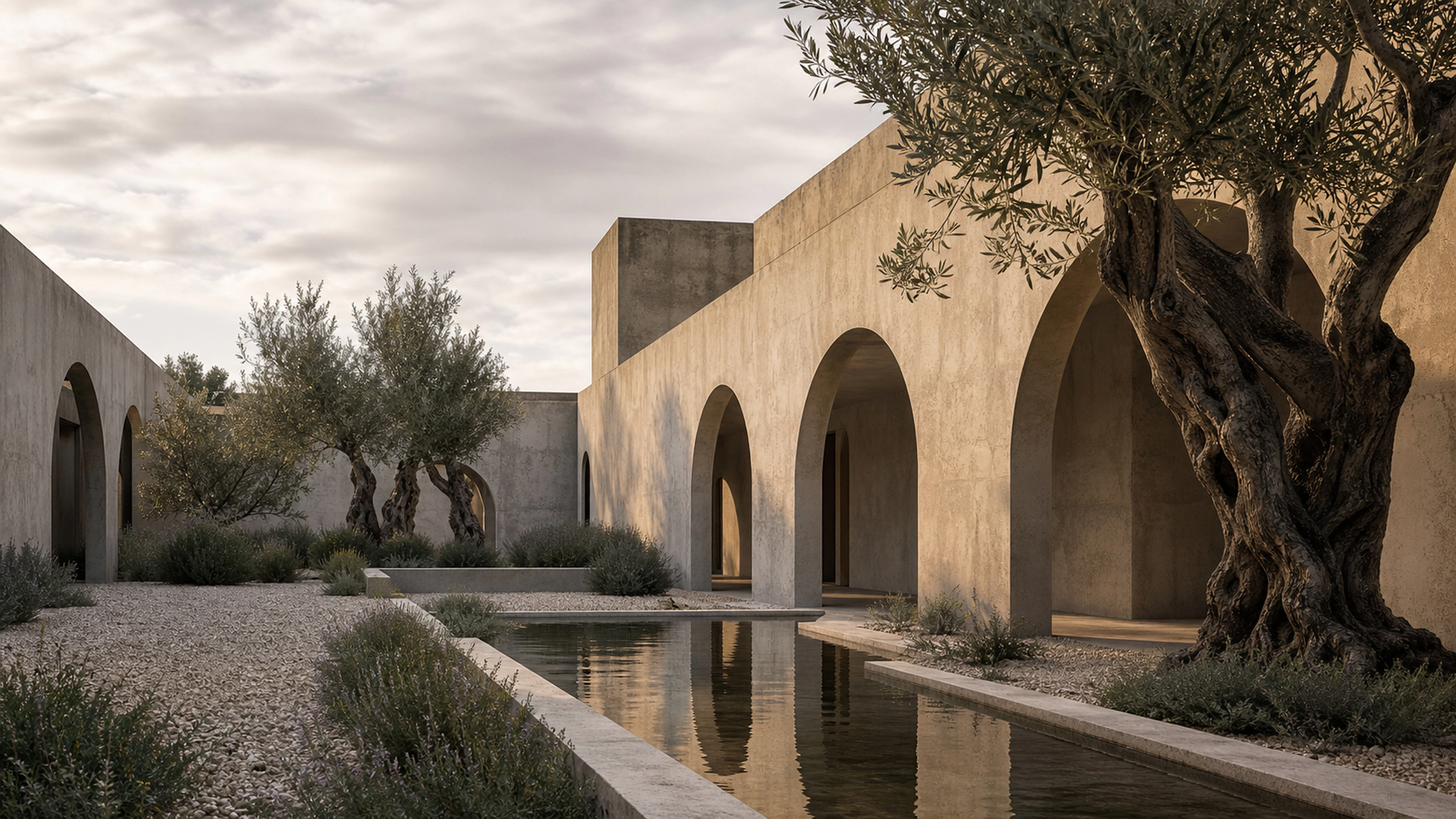 Original sunken courtyard with low arches, gravel, herbs and sculptural olive trunks, original 4K architecture wallpaper