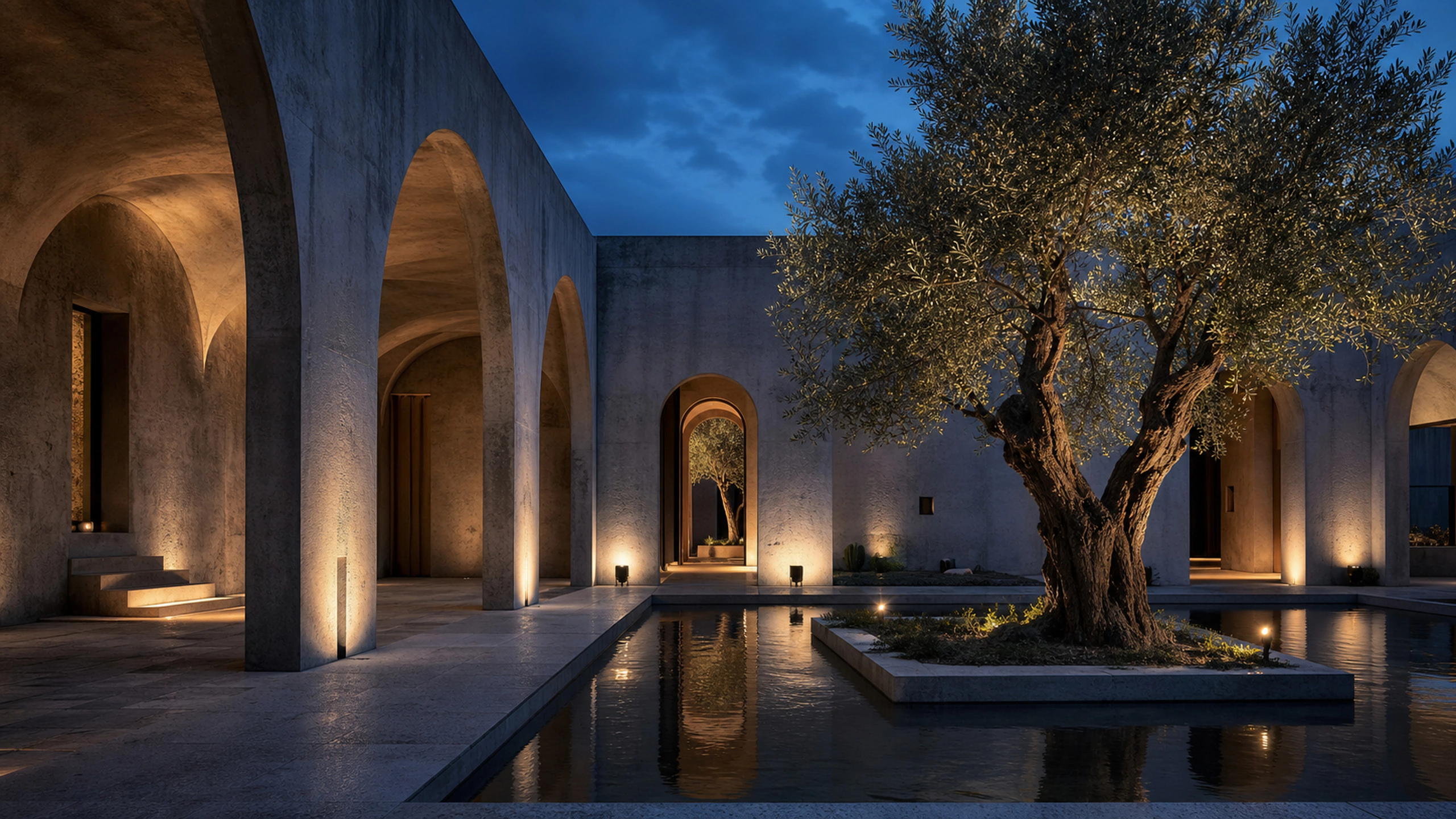 Restrained warm architectural lighting across arches and an olive tree at blue night, original 4K architecture wallpaper