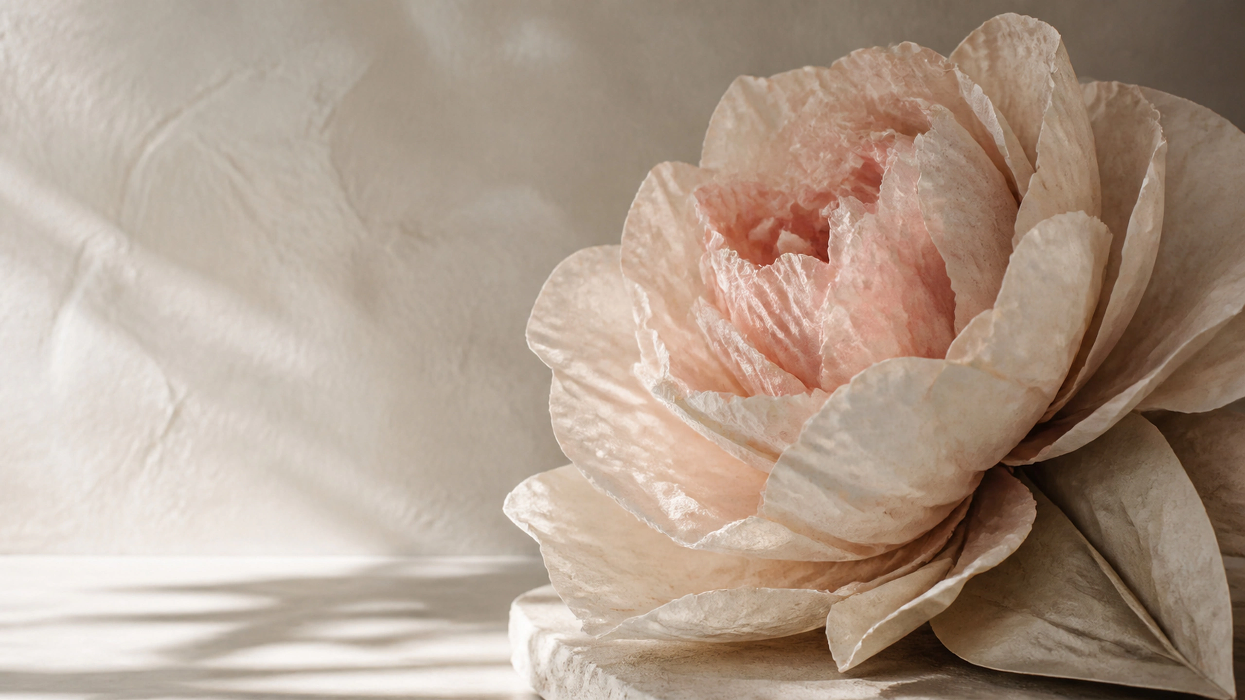 Large hand-folded paper peony sculpture, visible fibers, warm cream and blush forms, original 4K abstract wallpaper