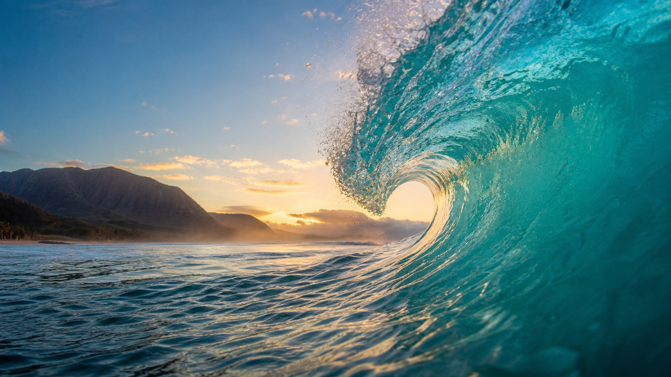 Water-level view through a clean turquoise wave barrel toward distant natural coast, original 4K ocean wallpaper