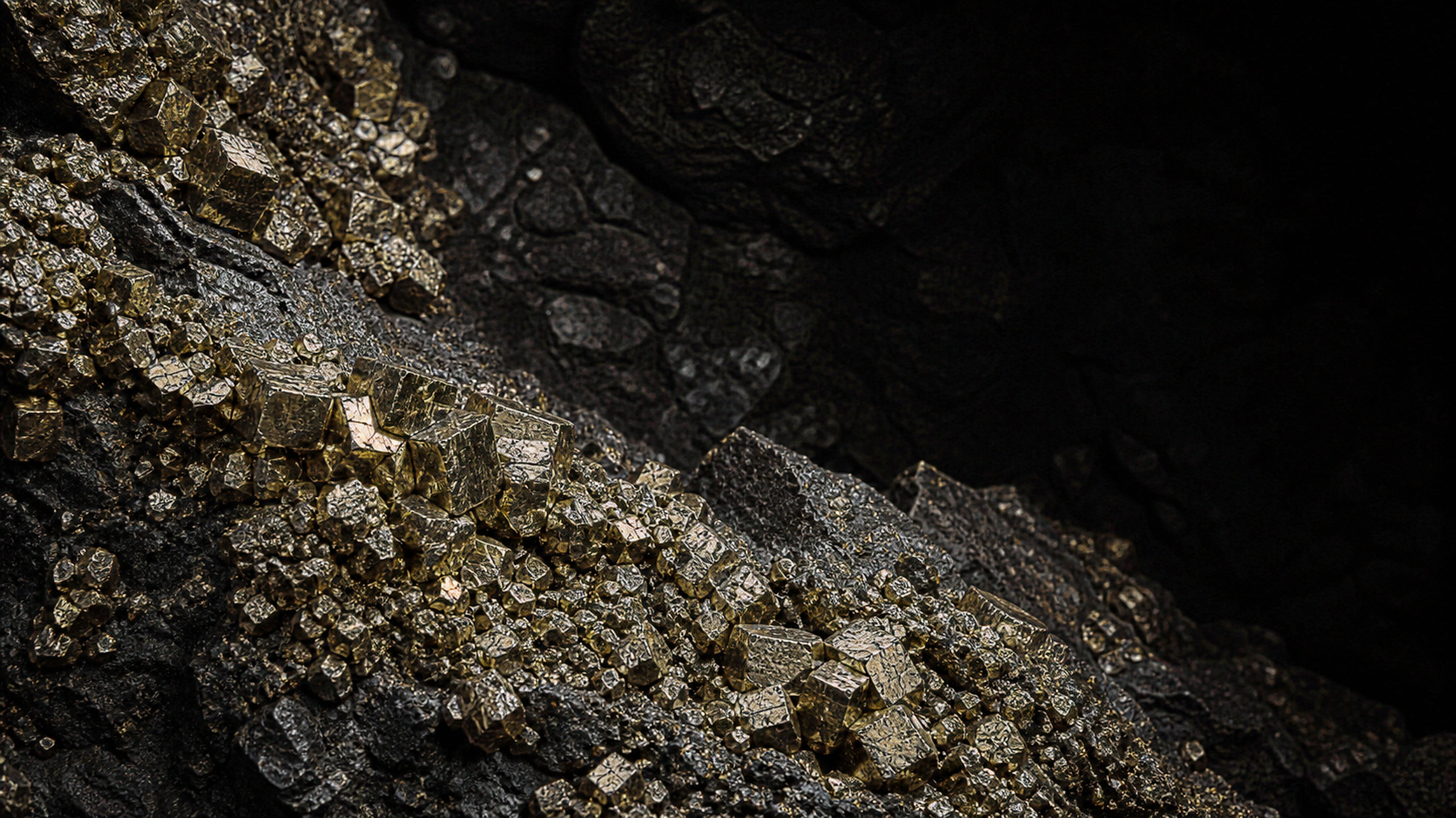 Dense pyrite crystal clusters emerging from a deep black cavern wall, thousands of discrete angular facets and restrained golden reflections, original 4K dark amoled wallpaper