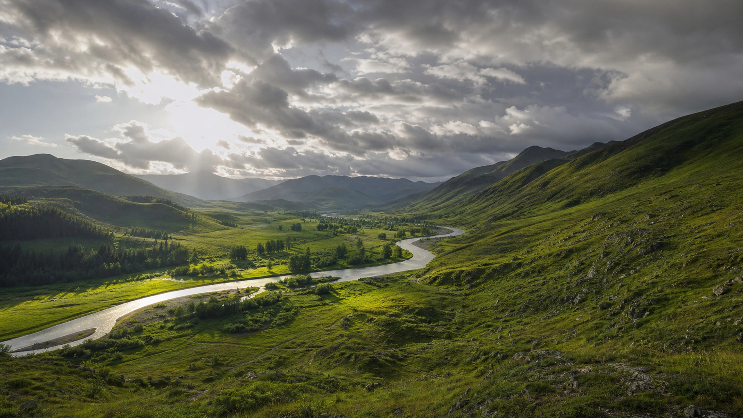 Rain-washed valley beneath broken clouds with sunlight moving across the slopes, original 4K nature wallpaper