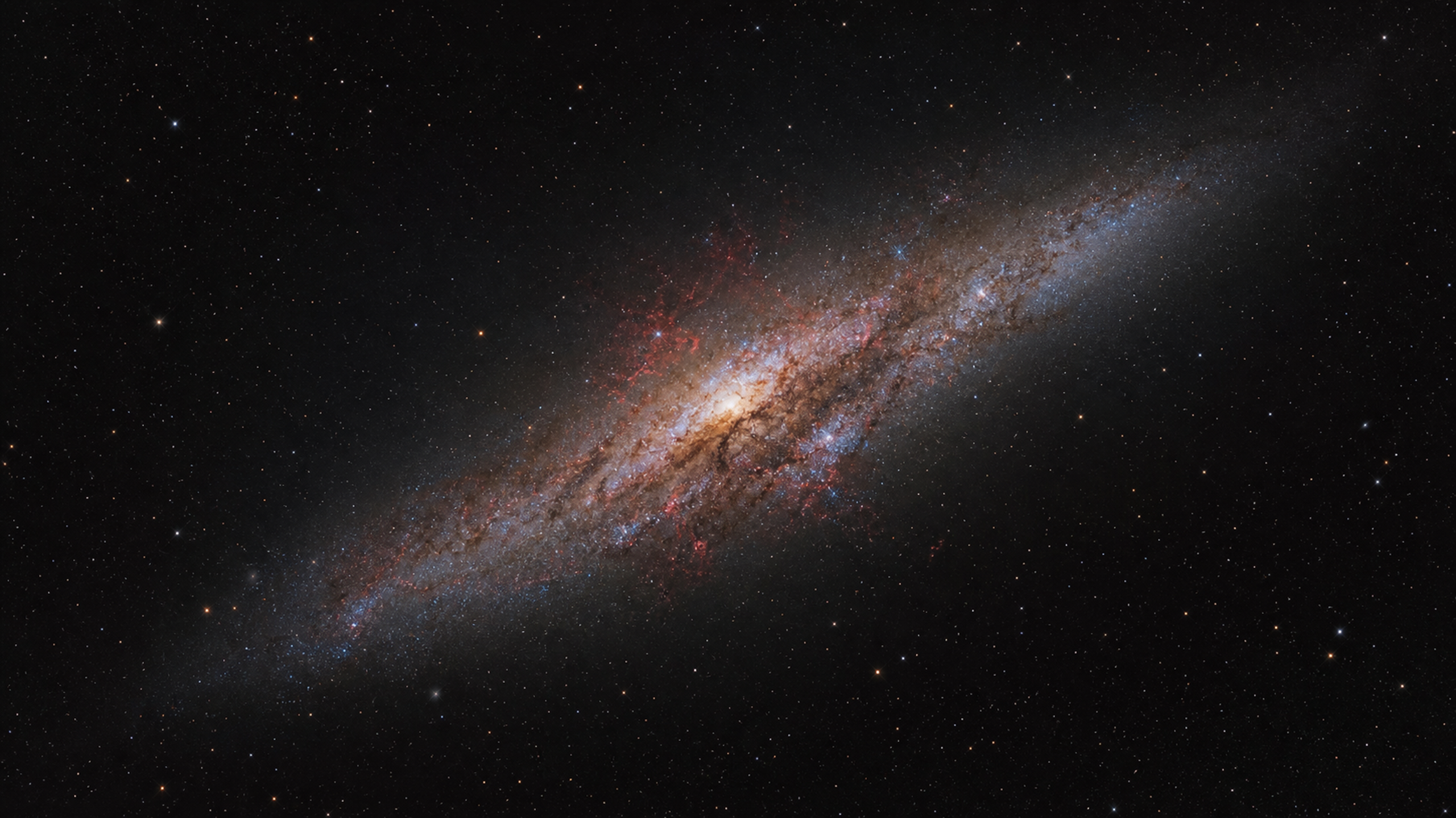 A compact starburst galaxy tilted diagonally through a broad star field, with dusty central structure, blue-white star formation knots and faint restrained red gas filaments, original 4K space wallpaper