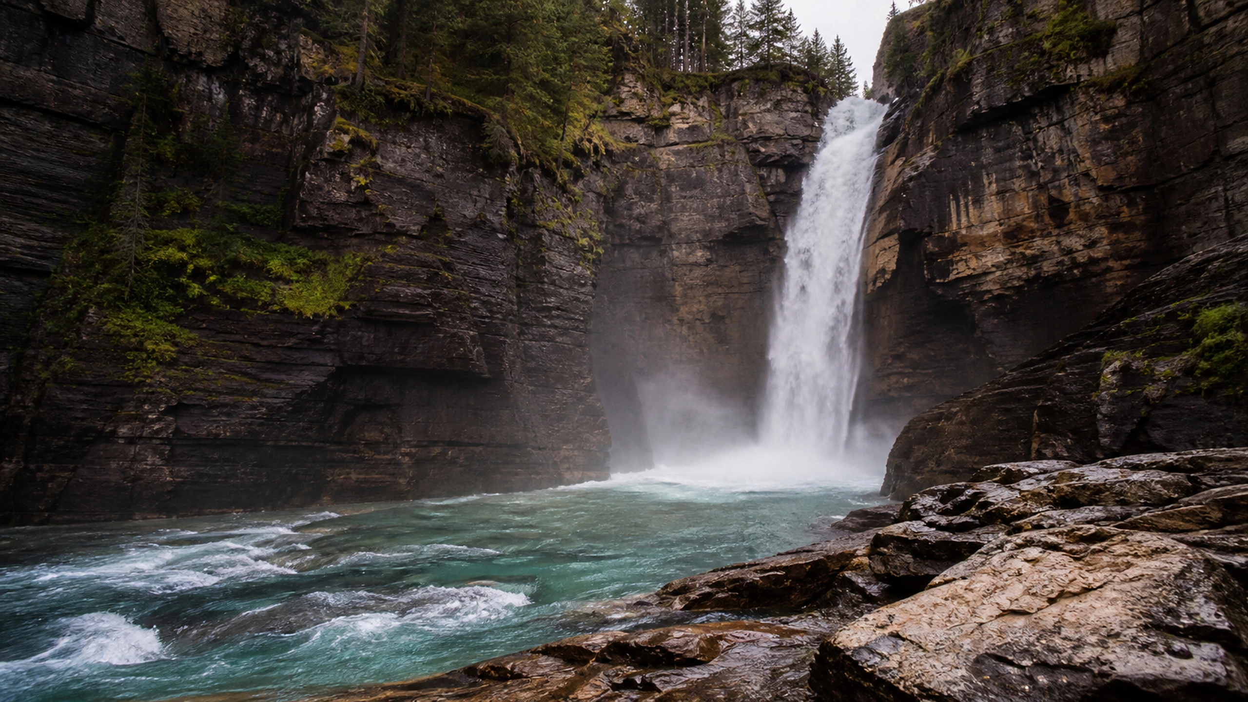 Single tall waterfall entering a narrow sandstone river canyon, original 4K lakes rivers wallpaper