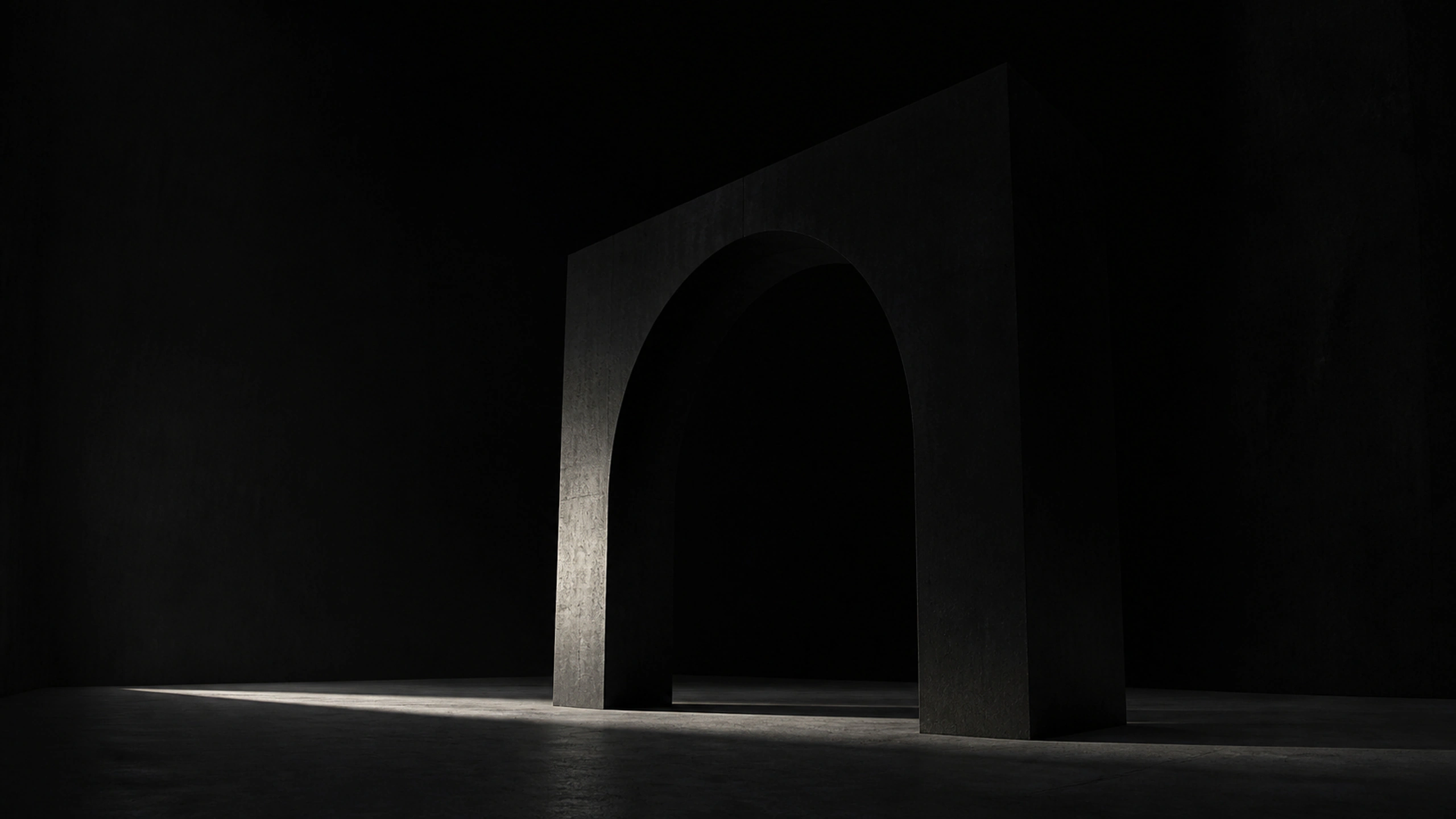 Single monumental matte-black concrete arch in a dark empty courtyard, narrow daylight blade and deep architectural shadow, original 4K dark amoled wallpaper