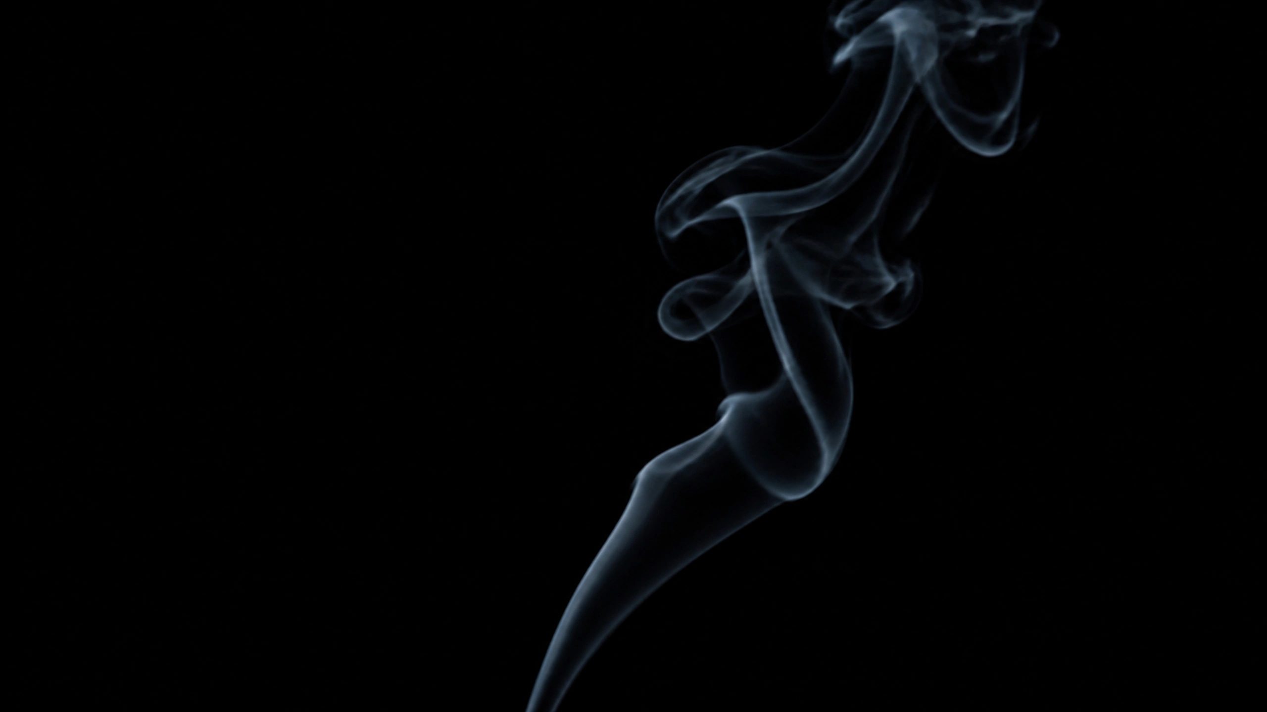 One realistic charcoal smoke ribbon turning through still black air, subtle edge illumination and uncrowded composition, original 4K dark amoled wallpaper