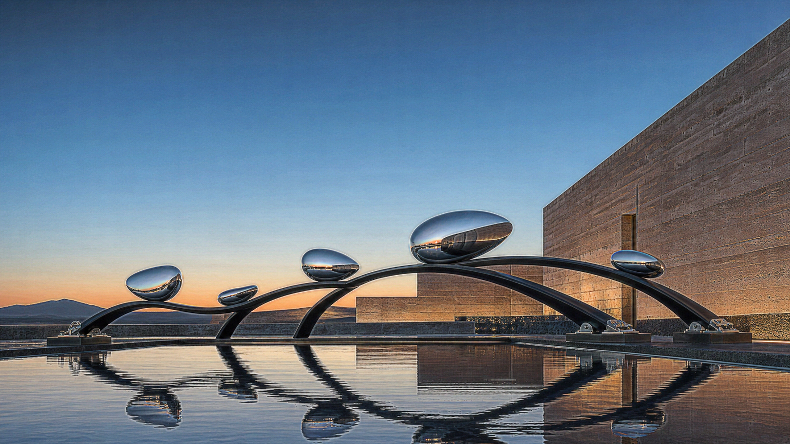 A gravity-defying but physically counterweighted arrangement of mirror-polished steel droplets and slender black ceramic arcs above a still reflecting pool, crisp reflections and tiny surface scratches, original 4K 3d renders wallpaper